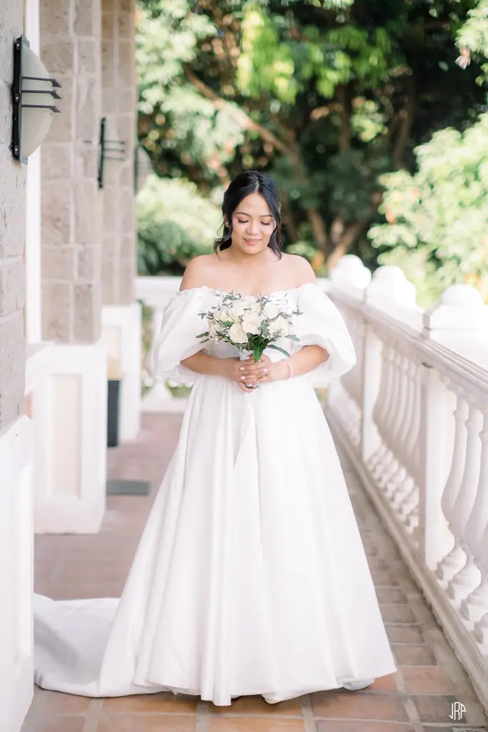 Full shot of the bride with snow white wedding dress after renting in the best gown rental shop in Pampanga