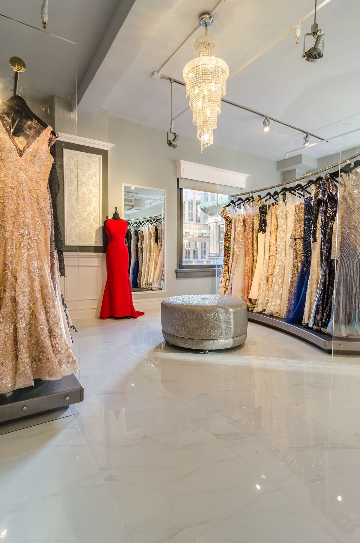 A wide selection of diverse formal and bridal gowns for gown rentals in Pampanga displayed inside a minimalist boutique at Paramalan Angeles City